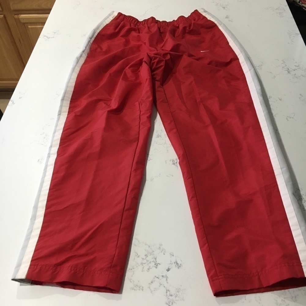 Nike sport red with white stripes on the side pants size:XXL